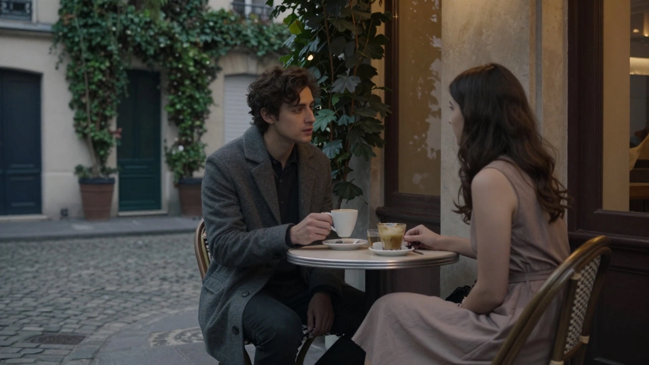 Two people having a calm, respectful conversation over coffee in a Montmartre café at dusk.